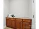 Laundry room featuring wood cabinets and a counter top at 8008 Battersea Ct, Waxhaw, NC 28173