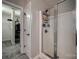 Bathroom featuring a shower with glass door and a walk-in closet with ample storage space at 10071 Highland Creek Cir, Indian Land, SC 29707