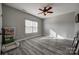 This bedroom offers a ceiling fan and neutral paint, creating a cozy and inviting atmosphere at 10071 Highland Creek Cir, Indian Land, SC 29707