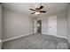 Large carpeted bedroom with neutral walls and ceiling fan at 10071 Highland Creek Cir, Indian Land, SC 29707