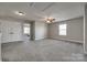 Spacious bonus room has neutral carpeting, a ceiling fan, and a closet with bi-fold doors at 10071 Highland Creek Cir, Indian Land, SC 29707