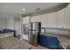 Kitchen with stainless steel appliances, granite countertops, and ample white and navy cabinet space at 10071 Highland Creek Cir, Indian Land, SC 29707