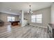 Open floor plan showing the spacious living room, dining area, and modern lighting at 10071 Highland Creek Cir, Indian Land, SC 29707