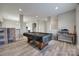 Expansive living room showcasing wood flooring and ample space for recreation and storage at 10071 Highland Creek Cir, Indian Land, SC 29707