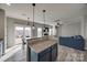 Open-concept living room featuring access to the eat-in kitchen and sliding doors to the outdoor patio at 10071 Highland Creek Cir, Indian Land, SC 29707