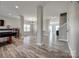 Open-concept living space featuring modern gray walls, stylish wood floors and abundant natural light at 10071 Highland Creek Cir, Indian Land, SC 29707