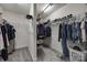 Spacious walk-in closet with ample storage, shelving, and hanging space for clothes and accessories at 10071 Highland Creek Cir, Indian Land, SC 29707