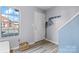 Bright entryway with a white front door, coat rack, and natural light streaming through the window at 102 Brandywine Ne Dr # R3, Conover, NC 28613