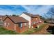 Rear exterior view of brick townhomes with fenced patios and well-maintained landscaping at 102 Brandywine Ne Dr # R3, Conover, NC 28613