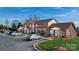 Exterior shot of townhomes with brick facades, landscaped grounds, and convenient parking at 102 Brandywine Ne Dr # R3, Conover, NC 28613