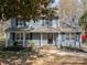 Charming two-story home boasts a well-manicured lawn, inviting front porch, and classic architectural details at 1024 Eaglewood Ave, Charlotte, NC 28212