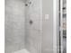 Bright shower stall with white marble tile, complemented by neutral walls at 1024 Eaglewood Ave, Charlotte, NC 28212