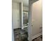 This bathroom features dark flooring, a glass-enclosed shower, and white trim at 103 High Rock Ct # 11, Statesville, NC 28677