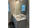 Bathroom with double sinks, a large mirror, modern faucets, and black tile floor at 103 High Rock Ct # 11, Statesville, NC 28677