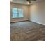 This bedroom features neutral walls, cozy carpet and a window with a view of the neighborhood at 103 High Rock Ct # 11, Statesville, NC 28677