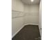 This walk-in closet has ample space for clothing and storage at 103 High Rock Ct # 11, Statesville, NC 28677