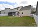 Spacious backyard with a patio, screened-in porch, and a well-maintained lawn at 1100 Millbank Dr, Matthews, NC 28104