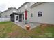 Patio area with outdoor seating, leading to a screened-in porch in the backyard at 1100 Millbank Dr, Matthews, NC 28104