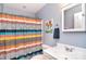 Bathroom featuring a single sink vanity, a colorful shower curtain, and wall decor at 1100 Millbank Dr, Matthews, NC 28104