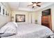 Comfortable bedroom with tray ceilings, natural light, four poster bed, and a TV at 1100 Millbank Dr, Matthews, NC 28104