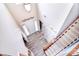 Bright foyer with a white front door, decorative accents, and a view of the carpeted staircase at 1100 Millbank Dr, Matthews, NC 28104