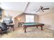 Spacious game room with a pool table, desk, and ample natural light from multiple windows at 1100 Millbank Dr, Matthews, NC 28104