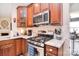 Bright kitchen featuring stainless steel appliances, gas range, and granite countertops at 1100 Millbank Dr, Matthews, NC 28104