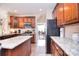 Spacious kitchen featuring granite countertops, stainless steel appliances, and wood cabinets at 1100 Millbank Dr, Matthews, NC 28104