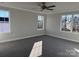 Bedroom with neutral walls, gray carpet, ceiling fan, crown molding, and large windows at 117 High Rock Ct # 9, Statesville, NC 28677