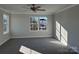 Bright bedroom with carpet, a ceiling fan, and a window letting in natural light at 117 High Rock Ct # 9, Statesville, NC 28677