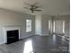 Comfortable living room featuring a ceiling fan, fireplace and entryways to other rooms at 117 High Rock Ct # 9, Statesville, NC 28677