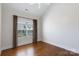 A bedroom featuring hardwood floors, a window with blinds and curtains at 126 Adelaide Way, Rock Hill, SC 29732