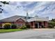 Brick Laurel Creek clubhouse featuring multiple windows, a covered entrance, and landscaping at 126 Adelaide Way, Rock Hill, SC 29732