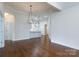 Open-concept dining area with a chandelier and view of the modern kitchen at 126 Adelaide Way, Rock Hill, SC 29732