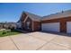 Brick townhome with attached garage, concrete driveway and manicured lawn at 126 Adelaide Way, Rock Hill, SC 29732