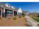 Charming brick townhomes with dormers, white trim, black fence, and manicured landscaping at 126 Adelaide Way, Rock Hill, SC 29732