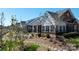 Brick townhome exteriors with white trim and a black fence with lush landscaping at 126 Adelaide Way, Rock Hill, SC 29732