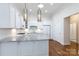 Bright kitchen featuring white cabinets, granite countertops, subway tile backsplash, and stylish pendant lighting at 126 Adelaide Way, Rock Hill, SC 29732