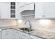 A close-up showcases a kitchen with granite countertops, subway tile backsplash, and stainless steel sink at 126 Adelaide Way, Rock Hill, SC 29732