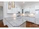 Modern kitchen featuring granite countertops, white cabinets, and stainless steel appliances at 126 Adelaide Way, Rock Hill, SC 29732