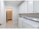 Bright laundry room with cabinets and sink, plus a washer and dryer at 126 Adelaide Way, Rock Hill, SC 29732