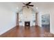 Spacious living room featuring fireplace, hardwood floors, vaulted ceiling, and large windows at 126 Adelaide Way, Rock Hill, SC 29732