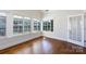 Bright sunroom featuring hardwood floors and large windows with a glass door at 126 Adelaide Way, Rock Hill, SC 29732