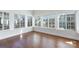 Bright sunroom featuring hardwood floors and large windows overlooking the yard at 126 Adelaide Way, Rock Hill, SC 29732