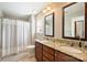 Bathroom featuring double sinks with granite countertops, vanity drawers, and a shower with curtains at 12889 Clydesdale Dr # 59, Midland, NC 28107