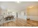 Inviting dining area showcasing hardwood floors, wainscoting, and elegant decor at 12889 Clydesdale Dr # 59, Midland, NC 28107