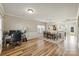 Open concept dining area with hardwood floors, large windows, and contemporary lighting at 12889 Clydesdale Dr # 59, Midland, NC 28107