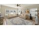 Bright living room featuring sofas, a patterned rug, and guitars hanging on the wall for decor at 12889 Clydesdale Dr # 59, Midland, NC 28107