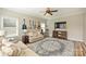 Comfortable living room with a ceiling fan, a large rug, and a view of the adjacent living area at 12889 Clydesdale Dr # 59, Midland, NC 28107