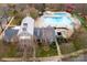 Aerial view of a community clubhouse and pool area with mature trees at 14946 Shinner Dr, Huntersville, NC 28078